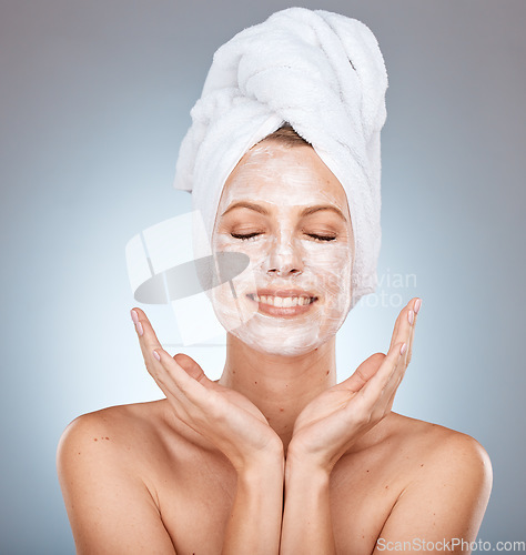 Image of Woman, beauty and smile for skincare face mask, cosmetics or cream against a grey studio background. Female model smiling with teeth for facial cleanse, detox or clean cosmetic skin hygiene on mockup