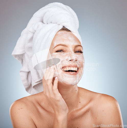 Image of Skincare, facial cream and woman with mask on gray background studio for wellness, beauty and spa. Dermatology, cosmetics and happy girl with moisturizer, facial mask and skincare products for face