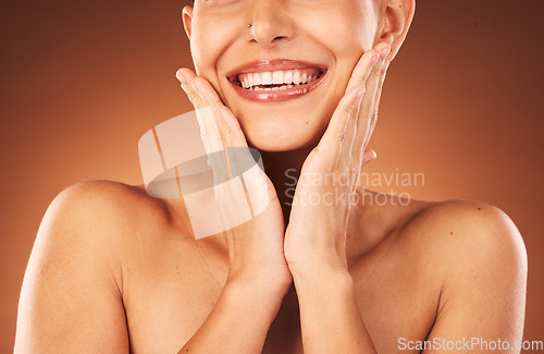 Image of Beauty, skincare and teeth, woman hands touching face for facial and cosmetics against studio background. Dental, lips and teeth whitening with veneers, wellness and cosmetic treatment with botox.