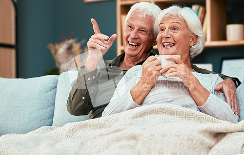 Image of Couple in retirement, elderly and watch television on couch at family home, relax with funny tv show or movie and excited with happiness and coffee. Retired, old man and old woman happy together.