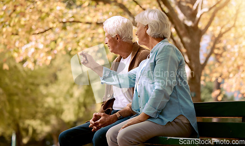 Image of Park love, communication and senior couple in nature to relax, retirement peace and outdoor conversation. Summer care, content and talking elderly man and woman on a bench in Portugal in spring