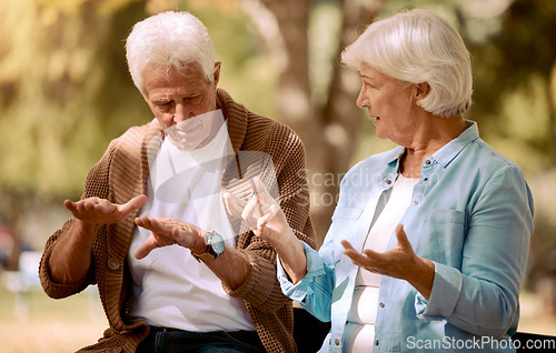 Image of Senior couple, love and hands in sign language communication in nature, public park or garden. Retirement elderly, gesture or deaf disability in bonding date for man and woman in support conversation