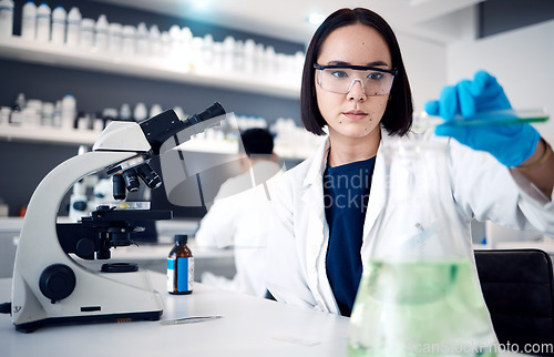 Image of Lab, medical science and asian woman with beaker for chemistry experiment, research innovation and engineering scientist. Scientist, biology analysis and expert working with chemicals in laboratory