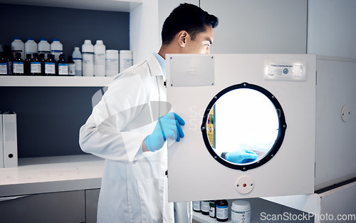 Image of Man, scientist and laboratory autoclave equipment for medicine temperature control, medical research storage or chemical mixing. Healthcare worker, science and centrifuge machine for dna engineering