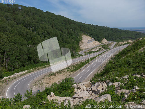 Image of Aerial top vew of winding road in the mountains