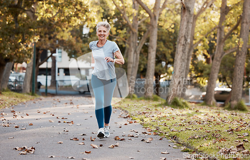 Image of Fitness, running and health with old woman in park for peace, workout and morning jog. Retirement, relax and jogging with senior runner training in nature for endurance, stamina and sports