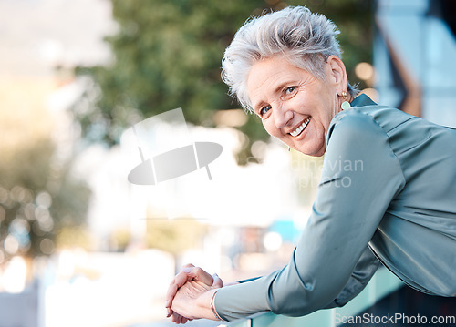 Image of Portrait, city and mockup with a woman manager in business standing outdoor on the balcony of her office. Face, happy and smile with a senior female CEO or boss outside during summer in an urban town