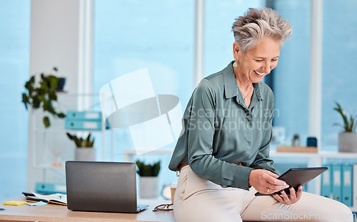 Image of Senior, business woman and tablet in office for social media, internet browsing or research. Happy, elderly and female employee from Canada with digital touchscreen for networking or web scrolling.