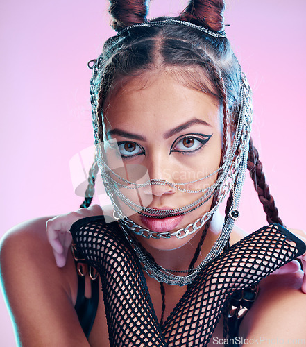Image of Model, bdsm and grunge fashion with makeup, jewelry and chains, goth aesthetic and punk rock clothes on studio background. Face, portrait and gen z girl with mask, cosmetics and halloween cosplay
