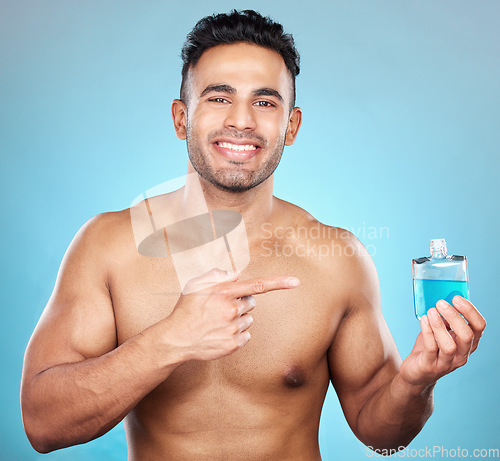 Image of Man, perfume and aftershave bottle for marketing, advertising and mockup for glass container, product placement and cosmetics. Portrait of India model with a smile for parfum, promo and aftershave