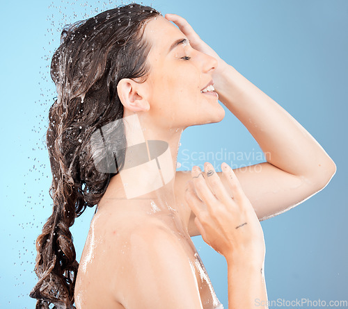 Image of Shower, water and woman cleaning body and hair for skin wellness, health and wash. Water splash, cosmetic and beauty care of model doing skincare and morning self care with water drops feeling clean