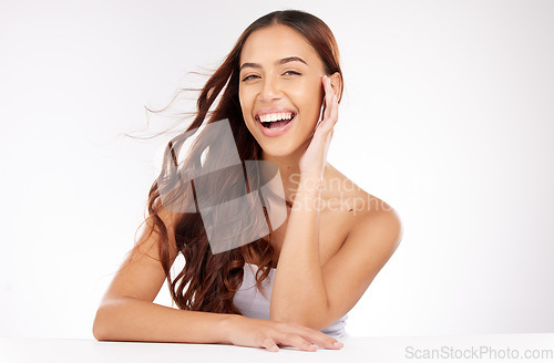 Image of Beauty, skincare and woman in studio with hair care, cosmetics and natural makeup on white background or marketing space. Happy, portrait and teeth of young model for beauty salon mockup advertising