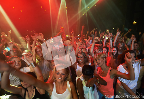 Image of Concert music, rock and crowd of people with disco party lights for dance, performance and singing together in psychedelic festival. Night club, techno and rave with group of people or youth dancing