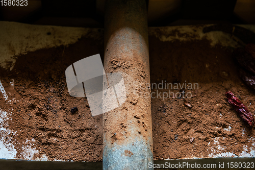 Image of Grinding cacao beans with chili peppers