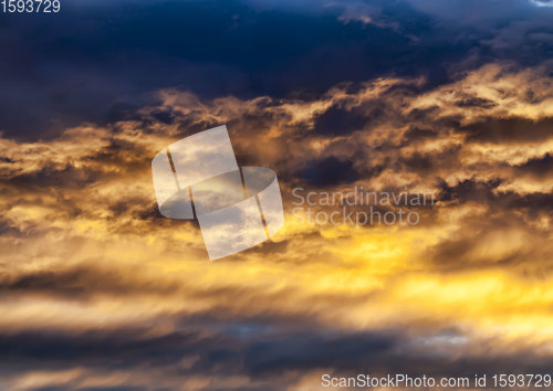 Image of dark clouds and bright sunlit sky