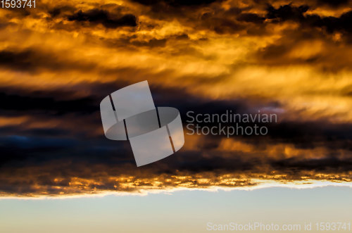Image of dark clouds and bright sunlit sky