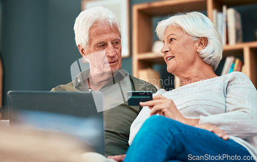Image of Senior couple, laptop and credit card for online shopping, ecommerce and paying bills online while talking about savings, investment and retirement. Old man and woman together for banking payment