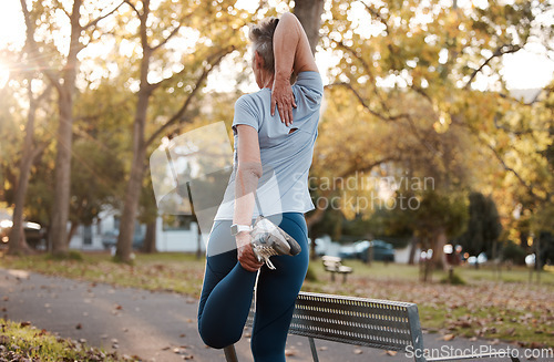 Image of Stretching, park and legs of senior woman for running, training and workout with outdoor wellness, body goals and motivation. Warm up, healthy and fitness sports runner on path in nature for cardio