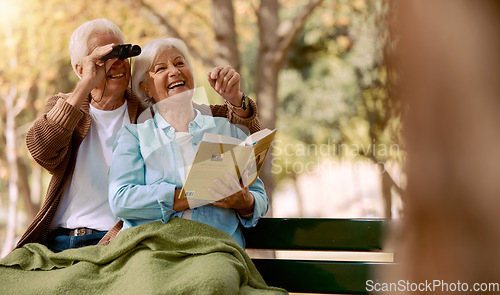 Image of Love, senior couple and watching birds with book, binocular and romantic together. Romance, mature man and elderly woman in nature, happy and talking about animals, notebook and park bench for hobby.