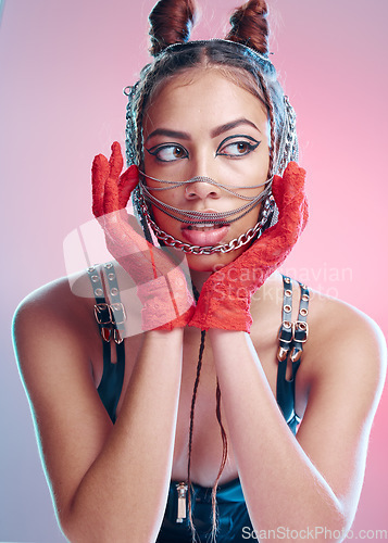 Image of BDSM, fetish and fashion with a model black woman in studio on a pink background for bondage, punk or rock. Leather, sexy and mask with a female inside for halloween or cosplay as a sex slave