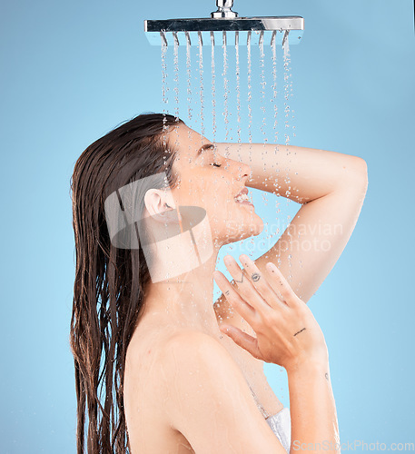 Image of Woman, shower and water mockup for skincare health, showering for clean skin and natural wellness. Healthy beauty model, happy face and advertising healthcare or hygiene on a studio blue background