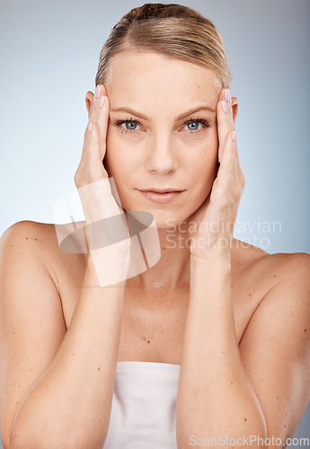 Image of Portrait, woman and skincare in studio for beauty, wellness and eye lift with blepharoplasty on grey background. Face, model and facial for wrinkles prevention with girl hands on skin with mockup