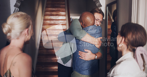 Image of Hug, love and friends meeting at a reunion, home support and social celebration at a housewarming. Diversity welcome, affection greeting and men and women hosting a party to celebrate friendship