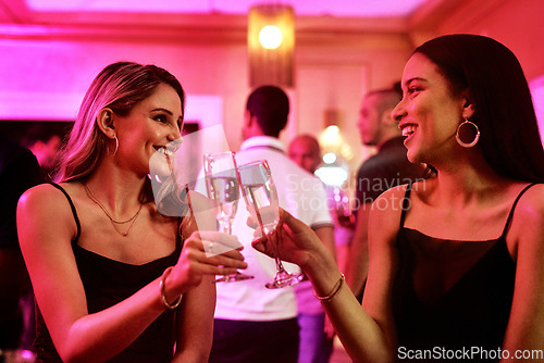 Image of Friends, toast and new year party at disco, event and nightclub with happy smile, celebration and nightlife. Women, cheers and social with champagne, drinks and celebrate together in club together