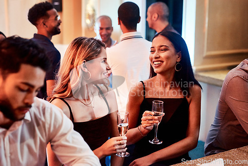 Image of Friends, party and alcohol drink, champagne and event at restaurant, happy smile and crowd conversation at night. People talking, drinking and happiness at club together talking, fun and social