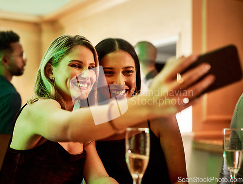 Image of Party, phone or friends taking a selfie for social media content or to post happy profile pictures on ladies night. Event, girls or women take a photo with wine or champagne drinks for a celebration