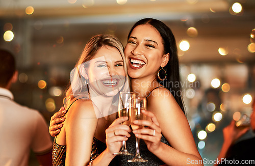 Image of Portrait, champagne and clubbing with woman friends drinking alcohol in celebration of the new year. Party, diversity and event with a female and friend enjoying a drink together at a luxury social
