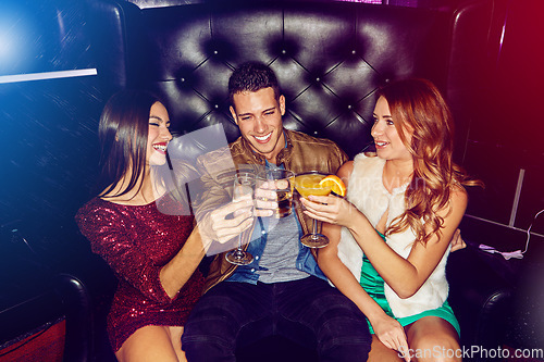 Image of Party, toast and people celebrating at a nightclub being cheerful and having fun while enjoying nightlife. Clubbing, alcohol drinks and friends partying with cocktails at disco event to celebrate