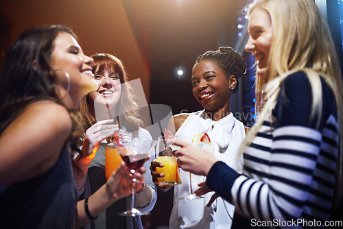 Image of Club drinks, night and women at a party, happy hour and social celebration for happiness. Disco communication, diversity and friends at an event with cocktails at a nightclub with music and smile