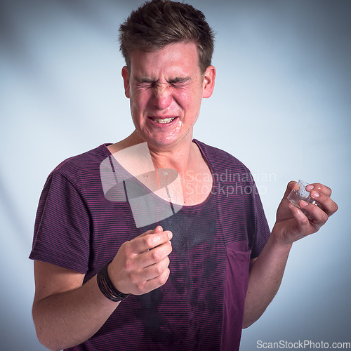 Image of Drunk man, alcohol and wet tshirt with a tequila shot, party and celebration event in grey studio background. Young male partying, beverage and drink shots, celebrating and house party with alcoholic