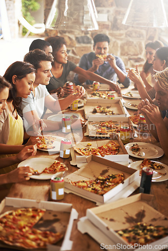 Image of Party, pizza and group of friends at table eating together, having fun and bonding. Food, communication and people celebrating at social gathering with beer, fast food and enjoying delicious lunch.