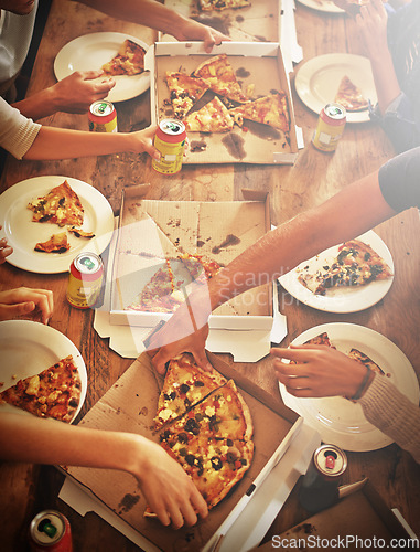 Image of Top view of pizza, hands and people with food, drink and celebration, party or social gathering event at dining table. Group of friends, fast food and pizzas in lunch, dinner and restaurant cafeteria