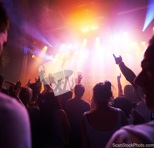 Image of Crowd, stage lights and live band music in party event, nightclub festival or dance floor concert. People, musicians and audience dancing in spotlight social disco, techno rave or rock entertainment