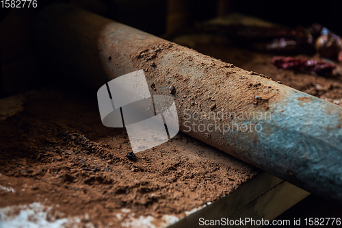 Image of Grinding cacao beans with chili peppers