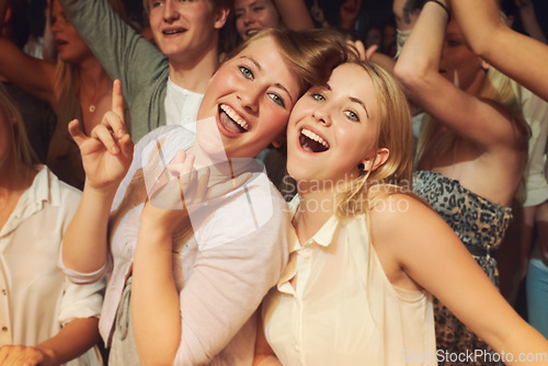 Image of Rock, dance night and friends at a concert, disco event or band performance in the crowd. Happy party, music smile and portrait of dancing women at a rave music festival, show energy and celebration