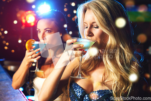 Image of Women, cocktail and drink at party or nightclub, celebrate new year with alcohol drinks, friends and drinking together. Celebration, fun at happy hour with social and holiday event with cocktails.