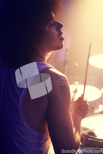 Image of Musician, drummer and music performance at concert, music festival in Los Angeles with band on stage, music and entertainment. Artist, rock or jazz with man playing drums, music concert with talent.