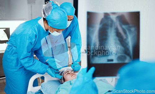 Image of Patient, surgeon and team in operating room, hospital and healthcare emergency, surgery or medical clinic. Doctors, nursing staff or workers in face mask, blue scrubs and working in operation theatre