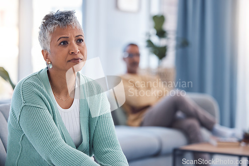 Image of Divorce, fight and sad with couple in living room for depression, fail marriage and toxic partnership. Angry, conflict and frustrated with man and woman on sofa for mental health, crisis and argument