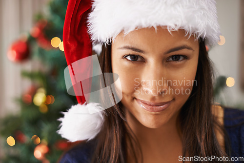 Image of Christmas, black woman and holiday celebration with smile hat and happiness to celebrate festive season with greetings and kindness. Portrait of female model in Mexico home excited for xmas in winter