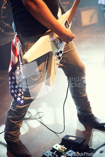 Image of Musician, legs and guitar for rock performance at music festival, dance and sing on stage for festival or concert in Nashville. Event, artist and music entertainment with rockstar and electric guitar