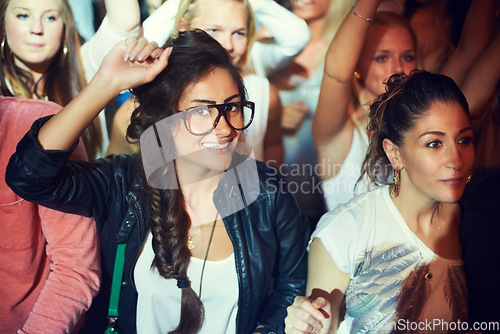 Image of Party, concert and women dancing in crowd enjoying holiday, new years eve and rave at nightclub. Energy, celebration and portrait of happy audience at music festival, disco event and band performance