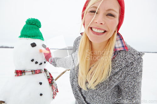 Image of Portrait, snow and woman building a snowman from Sweden in winter happy about holiday. Female face with happiness and christmas excitement on vacation outdoor for holidays travel in nature