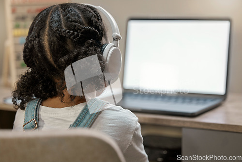 Image of Girl learning, laptop and education in home with headphones, internet and blank screen for study. Young african student, female and computer for video call, internet or webinar at house in Toronto