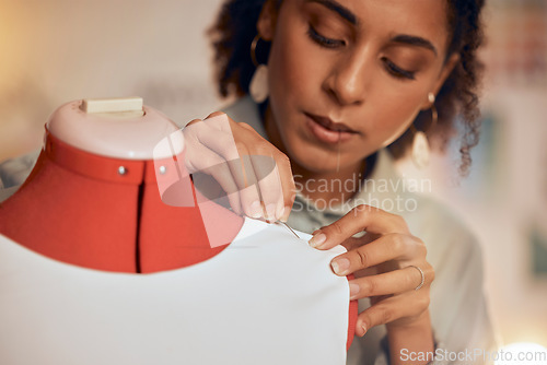 Image of Fashion designer, black woman and tailor working with fabric and needle for manufacturing, production and design process of clothes at workshop. Female entrepreneur with mannequin for creative work