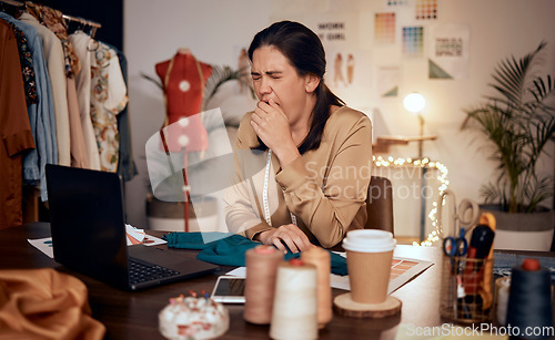 Image of Fashion, laptop and design woman tired after overtime on creative work, startup small business or luxury clothes. Fatigue, yawn and designer girl with burnout from working at night in studio workshop